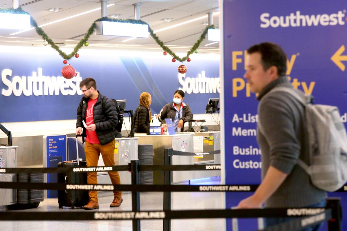 Man at airport at Southwest Airlines counter